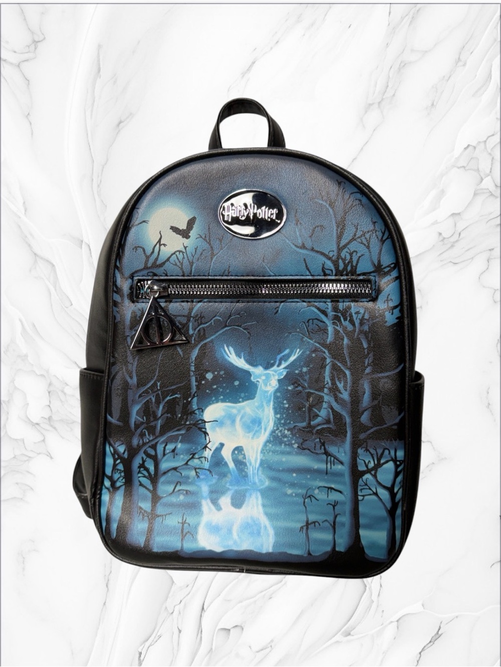 Harry Potter Patronus Mini Backpack featuring a glowing blue stag graphic